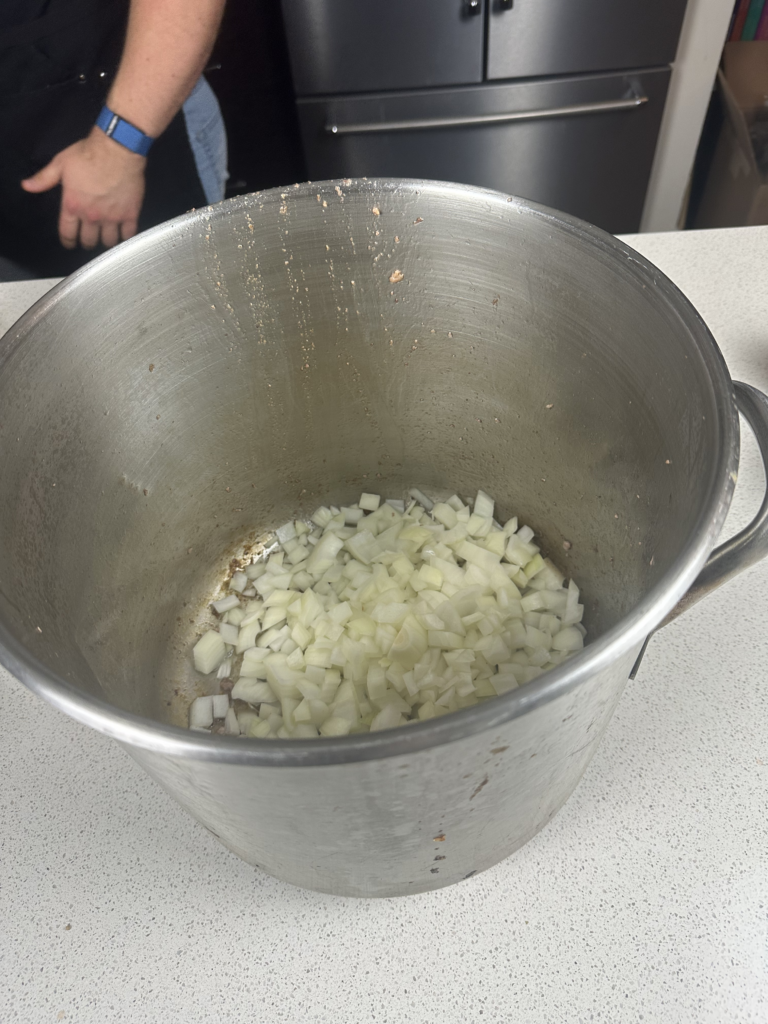 onions sweating in a large pot