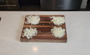 Four different onion cuts on a cutting board